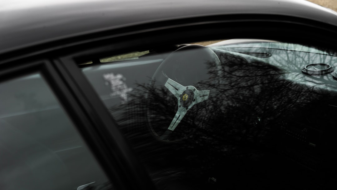 a close up of a car's windshield with trees in the background