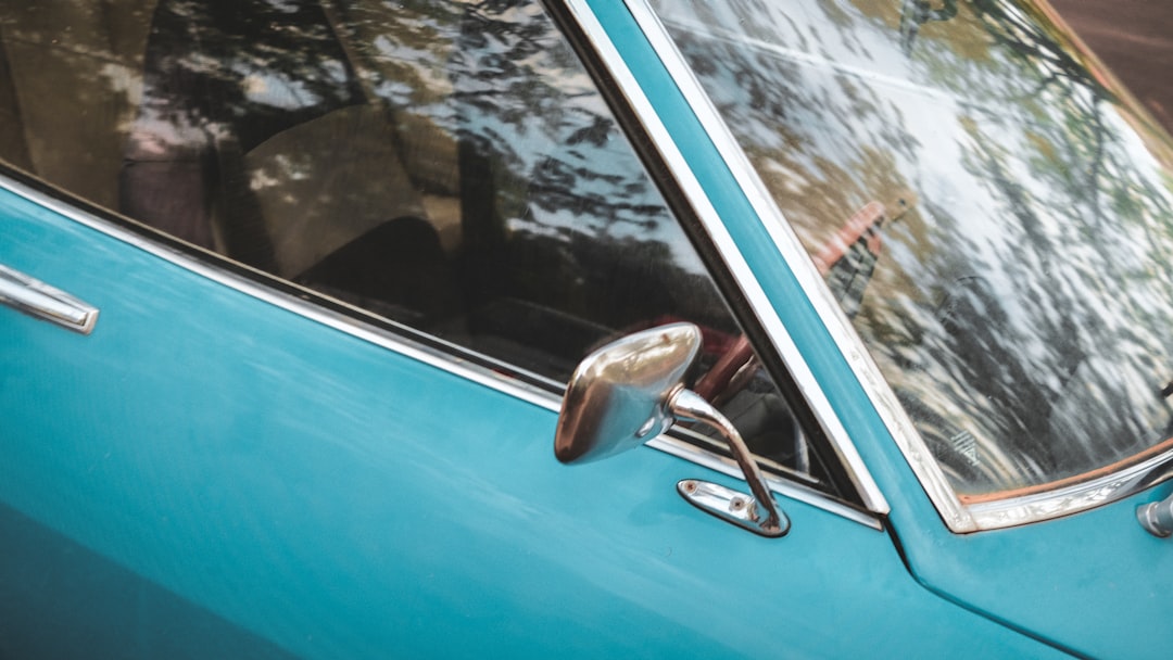 blue car with silver car side mirror