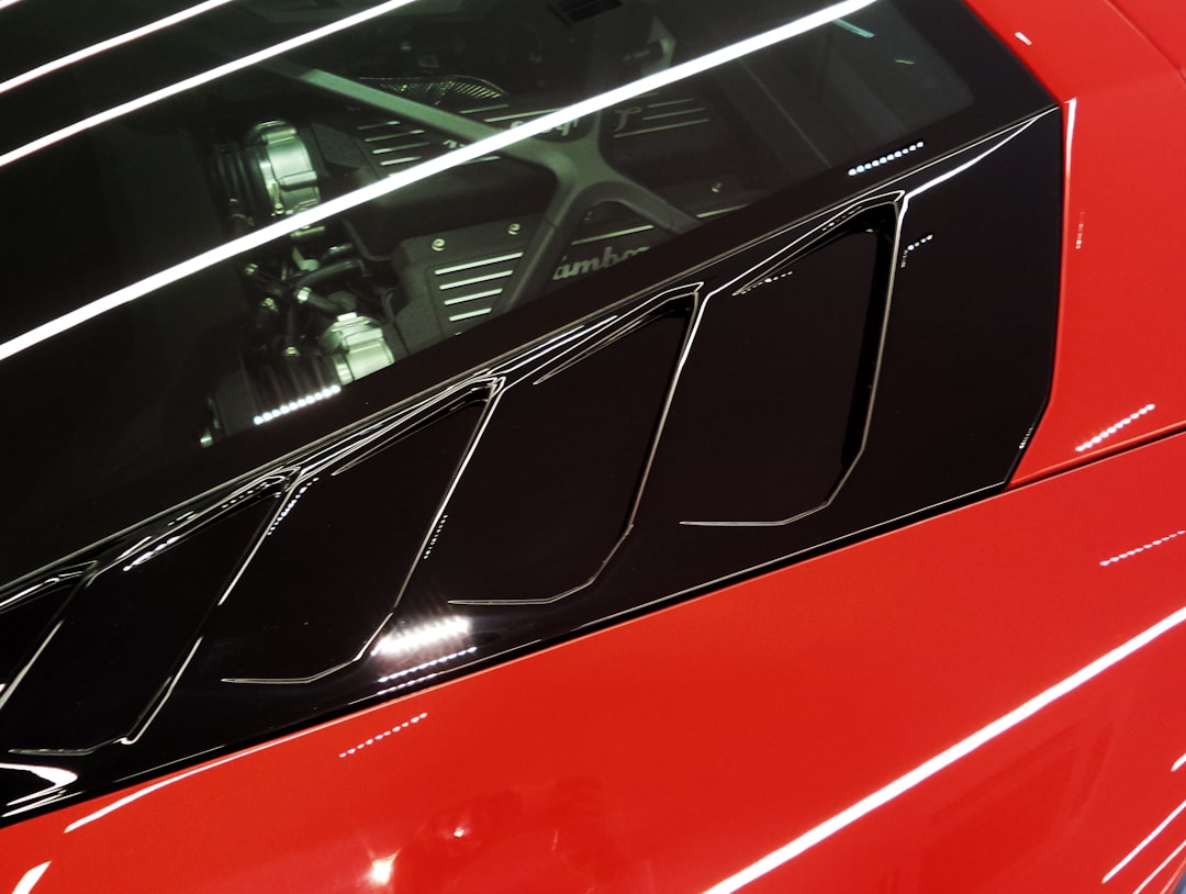 red car with white and black door